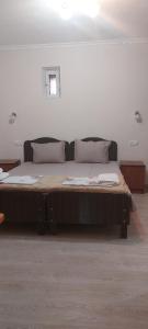 a large bed sitting in a room with at Hotel Botanical in Samarkand