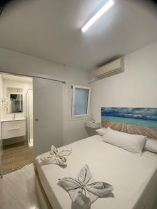 Postel nebo postele na pokoji v ubytování Hostal RENCH