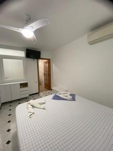 Postel nebo postele na pokoji v ubytování Hostal RENCH