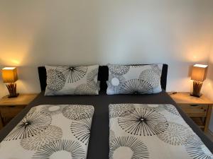 a bedroom with a bed with two pillows on it at Apartment Elisa in Osnabrück