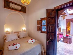 Postel nebo postele na pokoji v ubytování Kilimini Riad & SPA