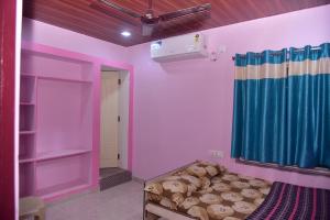 Postel nebo postele na pokoji v ubytování Sripada Kuteer + 12 fotografií