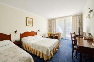 Postel nebo postele na pokoji v ubytování Hotel Belvedere Resort&SPA