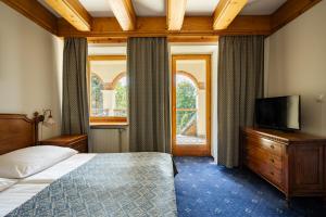 Postel nebo postele na pokoji v ubytování Hotel Belvedere Resort&SPA