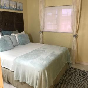 a bedroom with a large bed and a window at Perfect get away from big city life in Freeport
