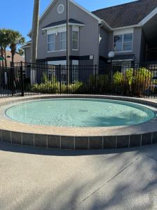 a small pool in front of a house at FMH Property Management in Orlando