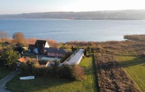 an aerial view of a house next to the water at Seezauber direkt am Wasser in Reichenau