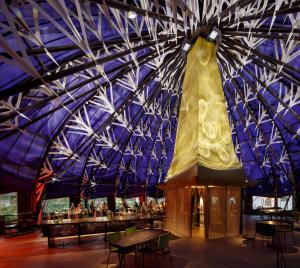 a large building with a large dress hanging from the ceiling at Le Bois des Chambres in Chaumont-sur-Loire