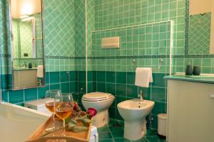 Bilik mandi di Reginella Guest House +58 gambar