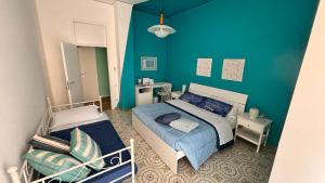 Katil atau katil-katil dalam bilik di Reginella Guest House