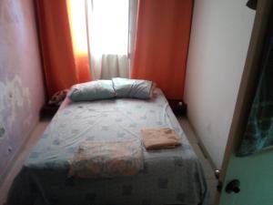 Postel nebo postele na pokoji v ubytování Borges Place + 1 fotografie
