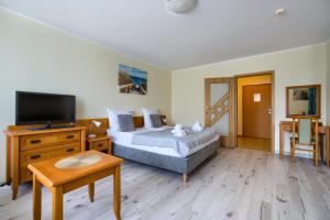 Posteľ alebo postele v izbe v ubytovaní ApartamentyPrzyMorzu Wschód Słońca Olymp z basenem