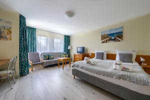 Posteľ alebo postele v izbe v ubytovaní ApartamentyPrzyMorzu Wschód Słońca Olymp z basenem