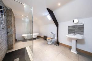 a bathroom with a shower and a sink and a toilet at Magnificent Period Country House in Rothley