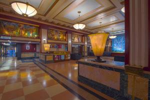 a lobby with a large vase in the center of a building at Hotel Edison Times Square in New York