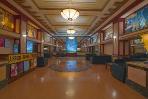 a large library with a lobby with couches and tables at Hotel Edison Times Square in New York