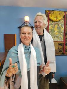 two older people giving the thumbs up in a room at STUPA VIEW INN in Kathmandu