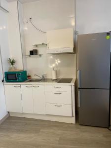 Dapur atau dapur kecil di Cómodo apartamento a pasos de la Gran Vía