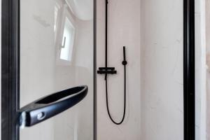 a bathroom door with a sink on a wall at BUQEZ ECO RESORT - Beach Villa 12 - Nice view in Drage