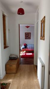 a hallway with a room with a bed in it at Secluded self-contained Annexe near town centre in St Austell