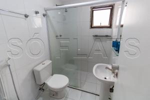 a white bathroom with a toilet and a shower at M-Flat Hotel Platinum - Paulista in Sao Paulo