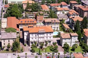 an aerial view of a city with buildings at Grand Hotel Liberty in Riva del Garda