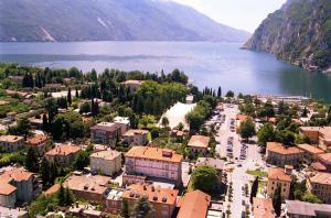 an aerial view of a town next to a lake at Grand Hotel Liberty in Riva del Garda
