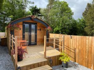 a wooden deck with a gazebo at Cow Hill Pod in Fort William