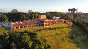 an aerial view of a house on a hill at Hotel Lago Dourado in Dois Vizinhos