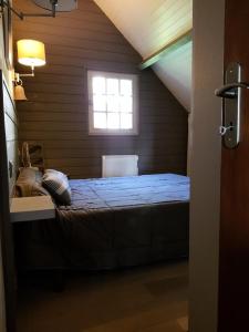 מיטה או מיטות בחדר ב-Résidence Maison Traditionnell - Maisons & Villas pour 10 Personnes 384