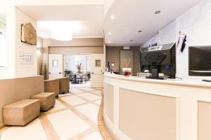 a lobby of a restaurant with a counter at Albergo Firenze in Florence