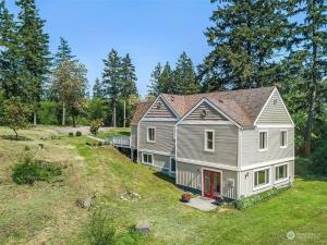 a large house on top of a hill at Secluded 4BR Nestled in Woods-Hot Tub/Dog Friendly in Friday Harbor