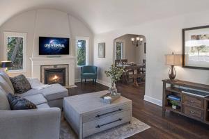 a living room with a couch and a fireplace at Secluded 4BR Nestled in Woods-Hot Tub/Dog Friendly in Friday Harbor