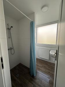 a bathroom with a shower and a sink at Zajazd Polonia in Kędzierzyn-Koźle