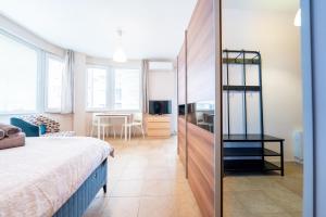 A bed or beds in a room at Lovely apartment in Studentski grad