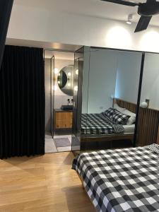a bedroom with a bed with a glass wall at Sima suite 3 in Ashdod