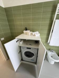 a small bathroom with a toilet and a sink at CASA LUISA - Comfortable APT in San Vitaliano 