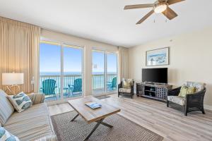 a living room with a view of the ocean at Calypso Resort and Towers #801-W by Book That Condo in Panama City Beach
