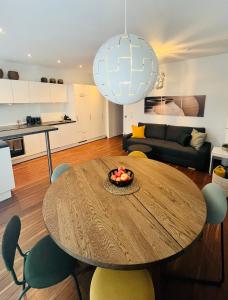 a living room with a wooden table and chairs at Apartment M4 in Salzburg