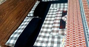 dos corbatas sentadas sobre una mesa en Hotel SleepInn, en Faisalabad