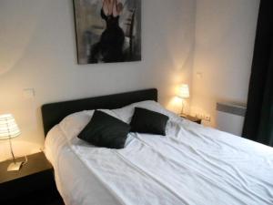 Postel nebo postele na pokoji v ubytování Résidence Pre St Jacques - Appartement 6/8 personnes au village de VIGNEC MAE-6264