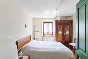 Postel nebo postele na pokoji v ubytování Conte Moro, ospitalità in Vanoi