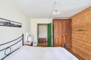 Postel nebo postele na pokoji v ubytování Conte Moro, ospitalità in Vanoi