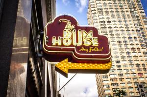 a sign for the house restaurant on the side of a building at Hotel Edison Times Square in New York
