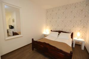 Postel nebo postele na pokoji v ubytování Garni Hotel Vila Drina