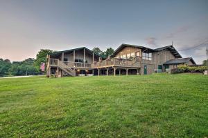 a large house with a large lawn in front of it at Pet-Friendly Tobyhanna Escape Near Hiking and Skiing in Tobyhanna