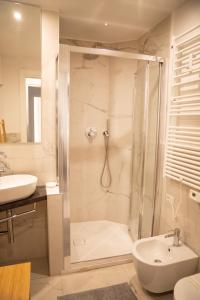 a bathroom with a shower and a sink at Bubi House Porta Romana in Milan