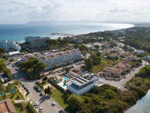 an aerial view of a resort next to the ocean at Mar Hotels Playa de Muro Suites in Playa de Muro