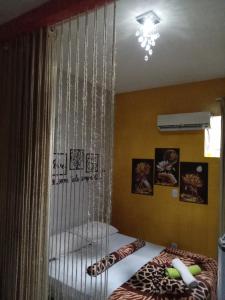 a bedroom with a bed with a hanging cage at Executive Suite - Ar e Wf Free in Aracaju