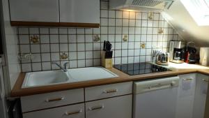 a kitchen with a sink and a counter top at Résidence Le Palos - A deux pas du téléphérique Résidence PALOS appartement 6 personnes MAE-0754 in Cadeilhan-Trachère